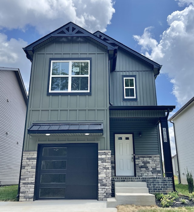 56 Charleston Cv, Clarksville, TN 37043 - view of front of property with board and batten siding, stone siding, and an attached garage
