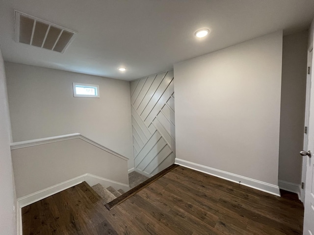 57 Charleston Cv, Clarksville, TN 37043 - below grade area with dark wood-style flooring, recessed lighting, and stairway