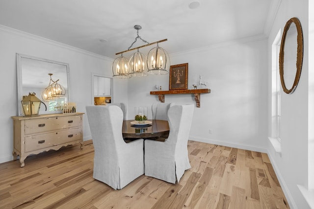 5594 Carters Creek Pike, Thompsons Station, TN 37179 - dining area with a chandelier, ornamental molding, light wood-type flooring, and baseboards
