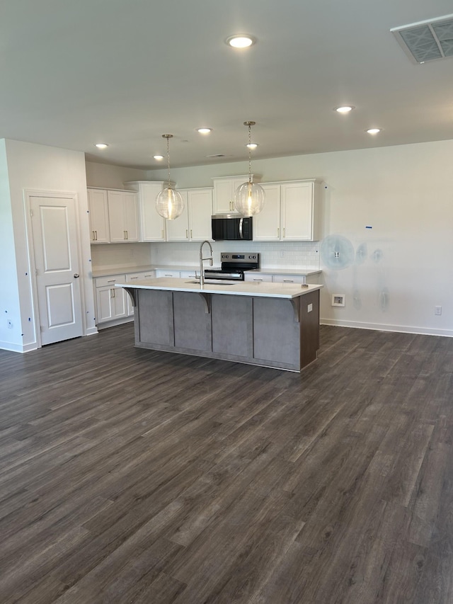 1075 Wrights Mill Rd Unit Arb066, Spring Hill, TN 37174 - kitchen with stainless steel appliances, white cabinets, baseboards, dark wood-style flooring, and light countertops