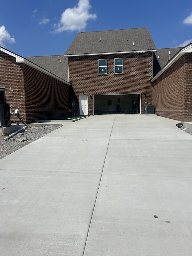 1075 Wrights Mill Rd Unit Arb066, Spring Hill, TN 37174 - view of side of property with concrete driveway, a garage, central air condition unit, and brick siding