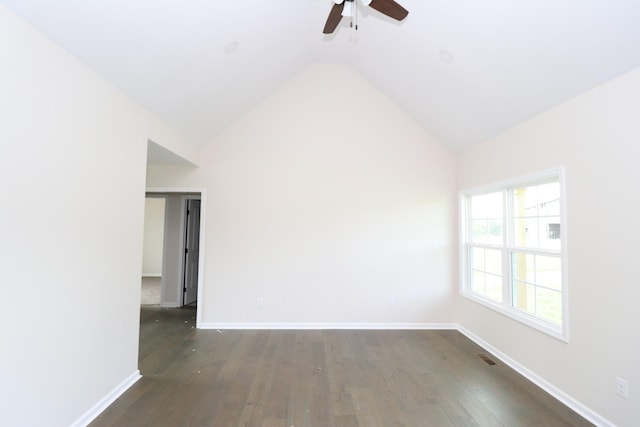 10172 Galen Rd, Lafayette, TN 37083 - spare room with a ceiling fan, vaulted ceiling, dark wood-style flooring, and baseboards