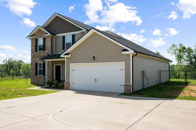 102 Murrell Rd, Dickson, TN 37055 - craftsman-style home with brick siding, driveway, and a garage