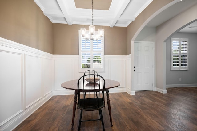 102 Murrell Rd, Dickson, TN 37055 - dining space featuring a chandelier, a decorative wall, coffered ceiling, dark wood-style floors, and arched walkways