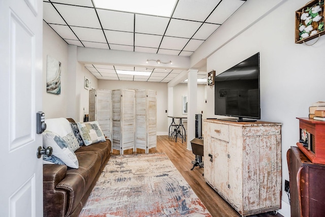 105 W Walnut St, Smithville, TN 37166 - living room with a paneled ceiling, wood finished floors, and decorative columns
