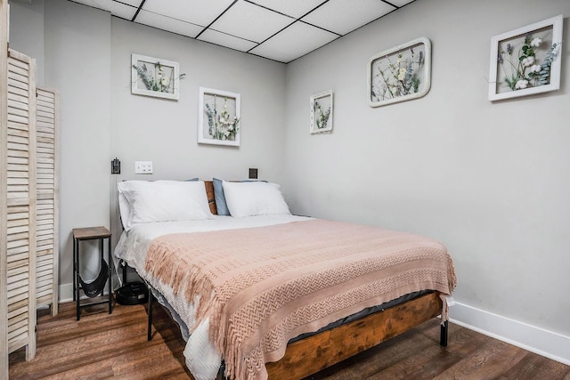 105 W Walnut St, Smithville, TN 37166 - bedroom with wood finished floors, baseboards, and a drop ceiling