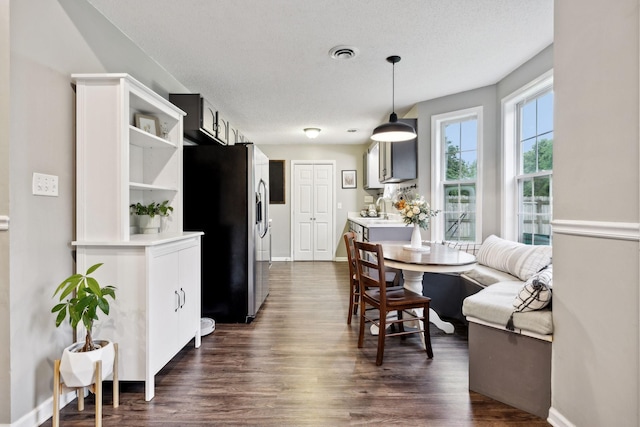 2236 Kim Dr, Clarksville, TN 37043 - dining space featuring dark wood-type flooring and baseboards