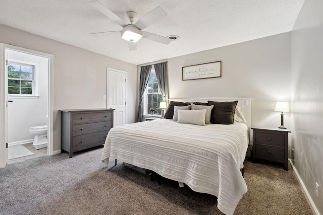 2236 Kim Dr, Clarksville, TN 37043 - carpeted bedroom featuring multiple windows, baseboards, connected bathroom, a ceiling fan, and a textured ceiling