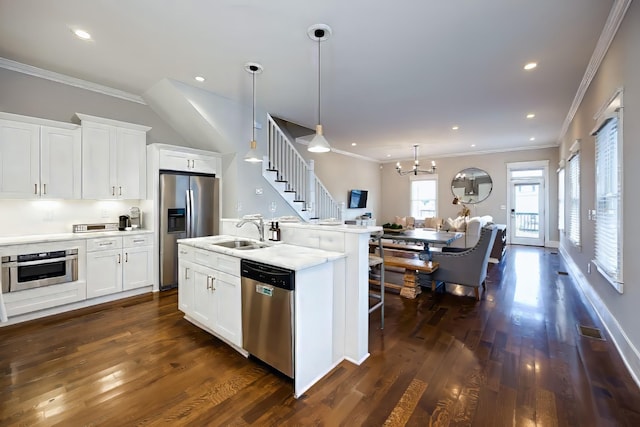 10B Fern Ave, Nashville, TN 37207 - kitchen with appliances with stainless steel finishes, a sink, crown molding, dark wood-type flooring, and white cabinets