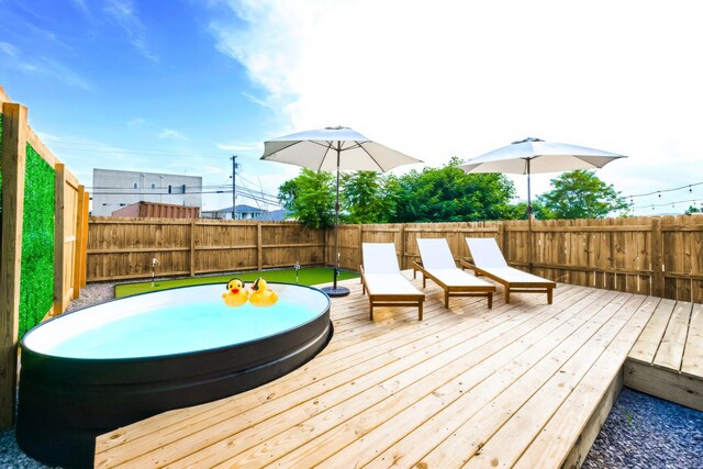 10B Fern Ave, Nashville, TN 37207 - wooden deck with a hot tub and a fenced backyard