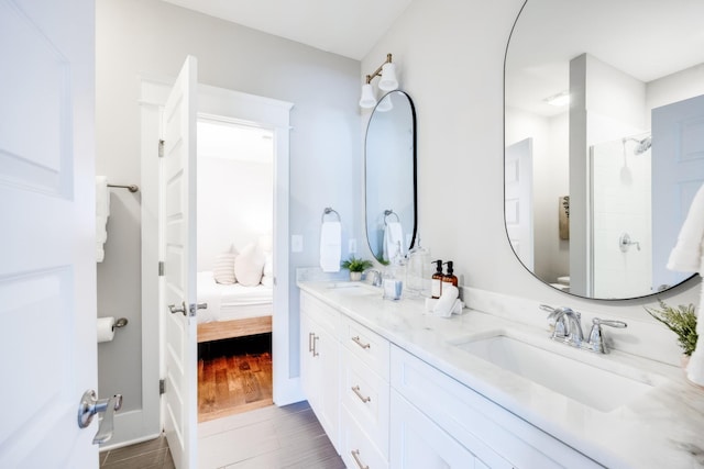 10B Fern Ave, Nashville, TN 37207 - bathroom featuring double vanity, ensuite bathroom, wood finished floors, and a shower