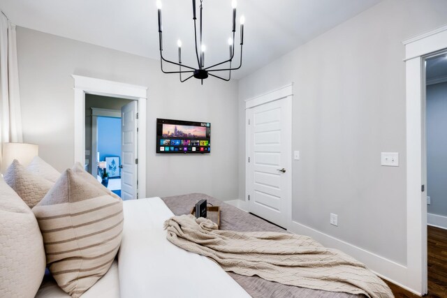10B Fern Ave, Nashville, TN 37207 - bedroom with a chandelier, dark wood-type flooring, and baseboards