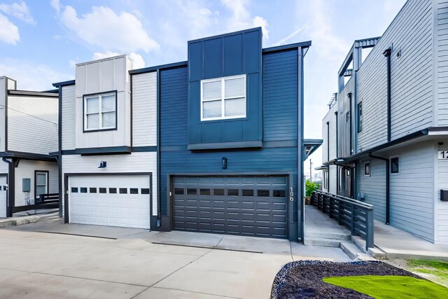 10B Fern Ave, Nashville, TN 37207 - view of front of home with board and batten siding, driveway, and an attached garage
