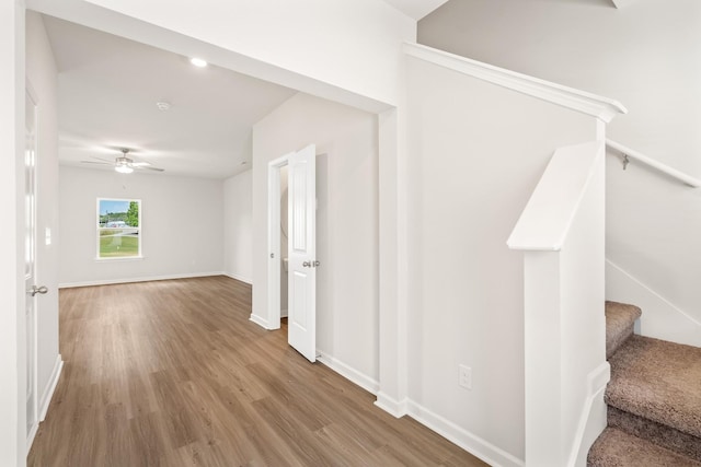 2042 Lala Loop, White Bluff, TN 37187 - hall with wood finished floors, baseboards, and stairway