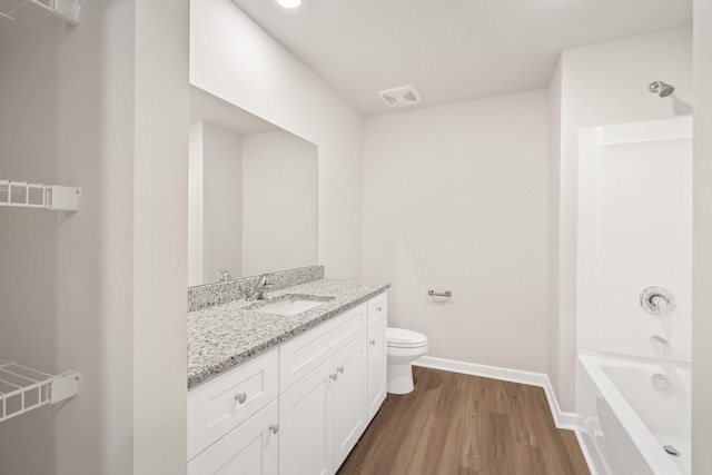 2046 Lala Loop, White Bluff, TN 37187 - bathroom featuring wood finished floors, vanity, baseboards, and toilet