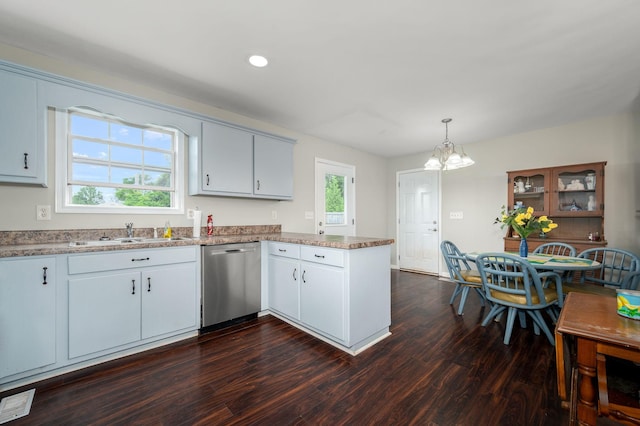 380 Strawberry Dr, Winchester, TN 37398 - kitchen featuring stainless steel dishwasher, a sink, a peninsula, a chandelier, and dark wood-type flooring