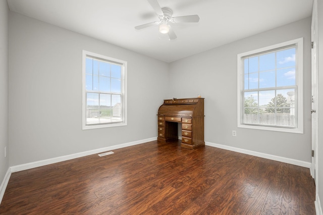 380 Strawberry Dr, Winchester, TN 37398 - unfurnished living room with plenty of natural light, dark wood-style flooring, and baseboards