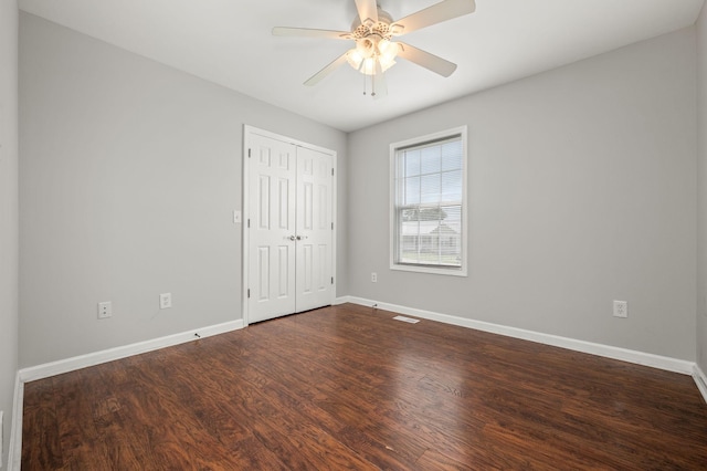 380 Strawberry Dr, Winchester, TN 37398 - unfurnished bedroom with baseboards, dark wood-style floors, a closet, and ceiling fan