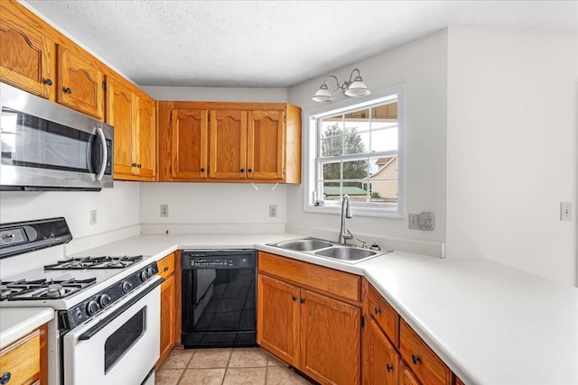 1910 Burlington Cir, Columbia, TN 38401 - kitchen featuring dishwasher, stainless steel microwave, gas range gas stove, a sink, and light countertops