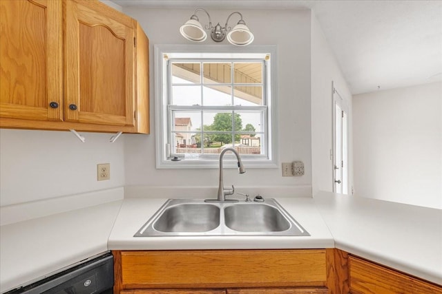 1910 Burlington Cir, Columbia, TN 38401 - kitchen with a sink, dishwashing machine, light countertops, and a chandelier