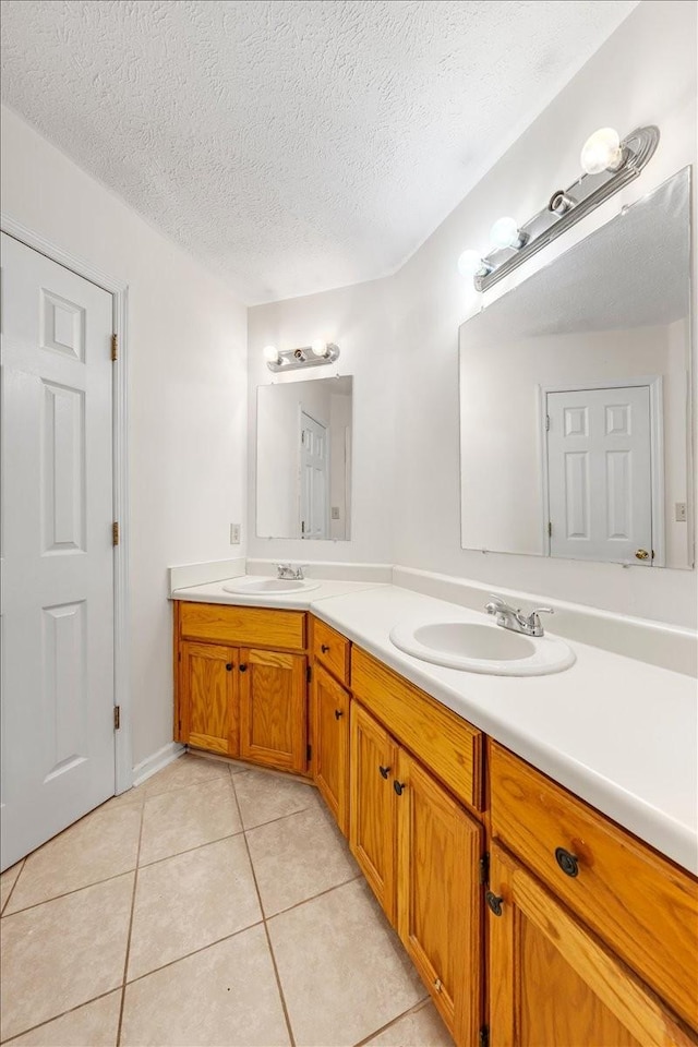 1910 Burlington Cir, Columbia, TN 38401 - full bathroom featuring double vanity, a textured ceiling, and tile patterned flooring