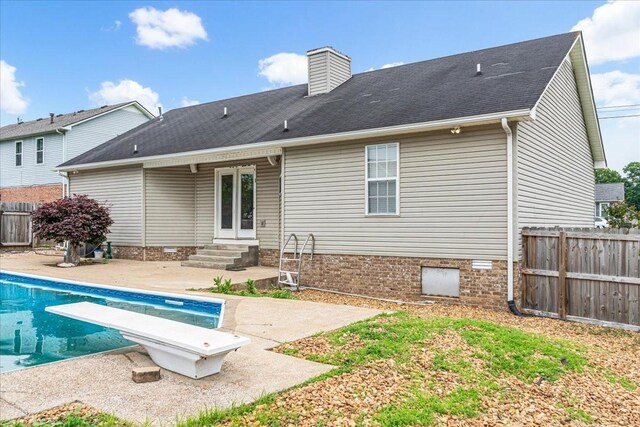 1910 Burlington Cir, Columbia, TN 38401 - back of property featuring entry steps, a patio area, a chimney, and roof with shingles