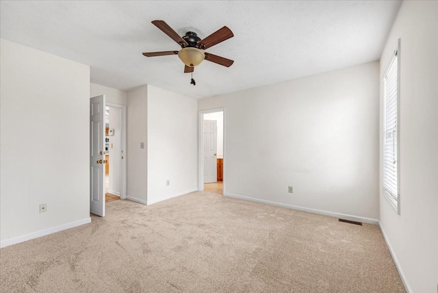 1910 Burlington Cir, Columbia, TN 38401 - unfurnished bedroom featuring light colored carpet, baseboards, a ceiling fan, and connected bathroom