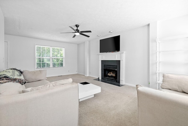 2829 Sharpie Dr, Clarksville, TN 37040 - living area with a fireplace with flush hearth, carpet floors, a ceiling fan, a textured ceiling, and baseboards