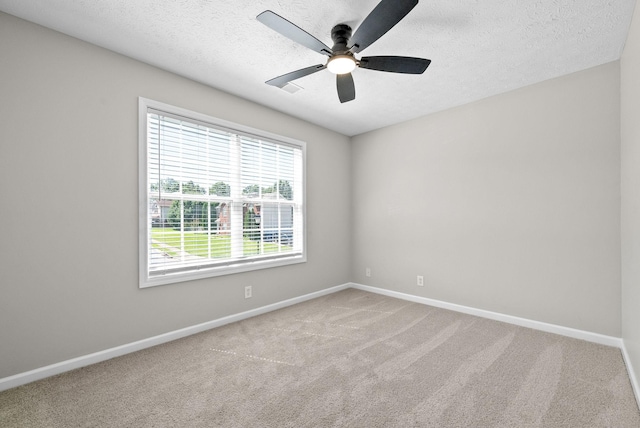 2829 Sharpie Dr, Clarksville, TN 37040 - unfurnished room featuring baseboards, ceiling fan, carpet, and a textured ceiling
