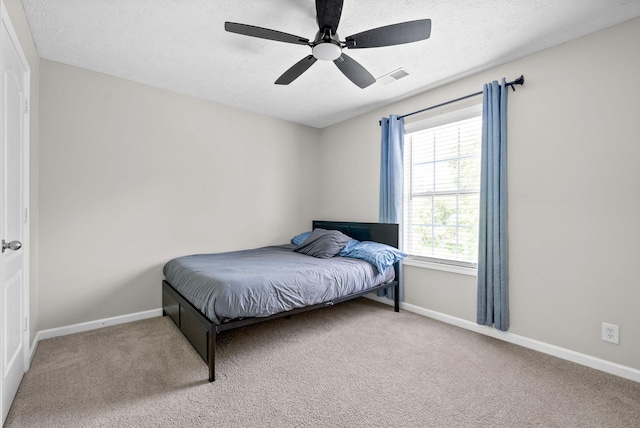 2829 Sharpie Dr, Clarksville, TN 37040 - carpeted bedroom with baseboards, a textured ceiling, and a ceiling fan