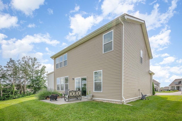 705 Watson Ct, Spring Hill, TN 37174 - back of house featuring an outdoor fire pit, a lawn, and a patio area