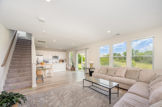 705 Watson Ct, Spring Hill, TN 37174 - living room featuring light wood-type flooring, recessed lighting, baseboards, and stairs