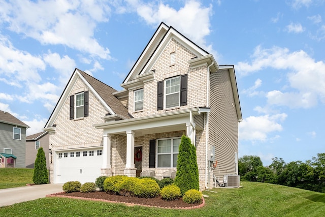 705 Watson Ct, Spring Hill, TN 37174 - view of front of house with covered porch, concrete driveway, a front yard, and an attached garage