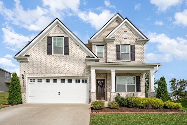 705 Watson Ct, Spring Hill, TN 37174 - craftsman-style home featuring covered porch, concrete driveway, an attached garage, and brick siding