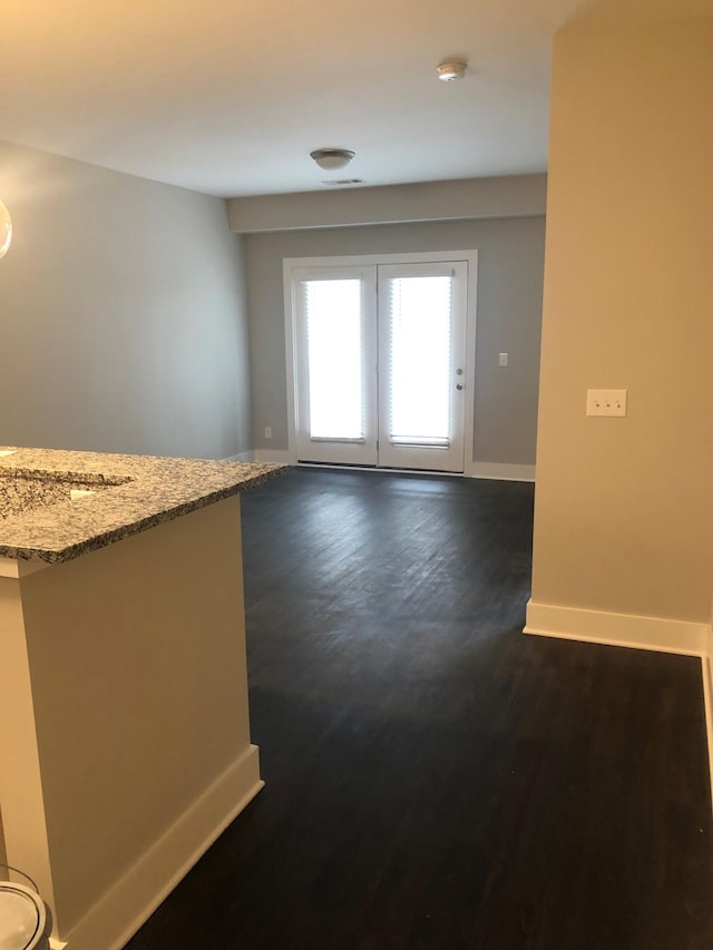 934 Governors Ct Unit 302, Antioch, TN 37013 - unfurnished room featuring baseboards, dark wood-style flooring, and a smoke detector