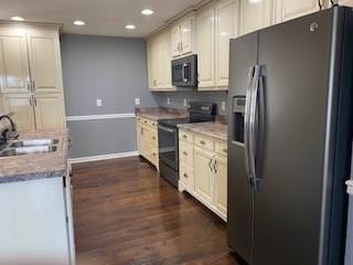 117 Raspberry Dr, Winchester, TN 37398 - kitchen with stainless steel fridge, electric range, black microwave, a sink, and dark wood finished floors