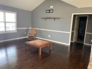 117 Raspberry Dr, Winchester, TN 37398 - living area with lofted ceiling, wood finished floors, and baseboards