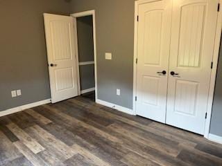 117 Raspberry Dr, Winchester, TN 37398 - unfurnished bedroom with baseboards, wood finished floors, and a closet