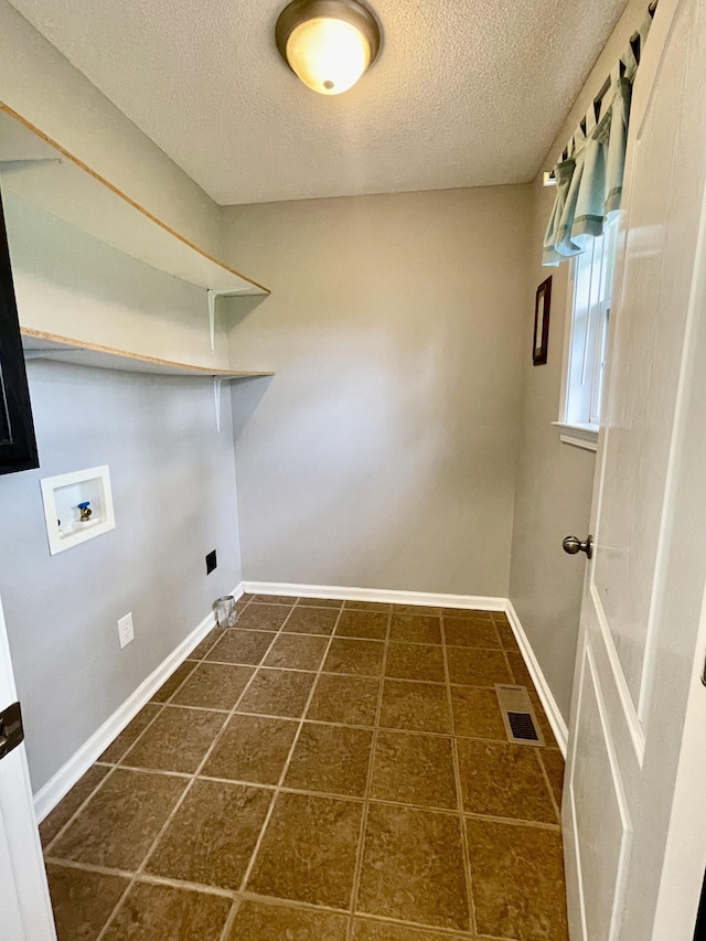 126 E Laurel Dr, Lawrenceburg, TN 38464 - washroom with washer hookup, a textured ceiling, and baseboards