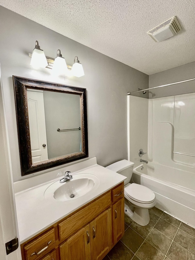126 E Laurel Dr, Lawrenceburg, TN 38464 - bathroom with vanity, shower / washtub combination, toilet, tile patterned flooring, and a textured ceiling
