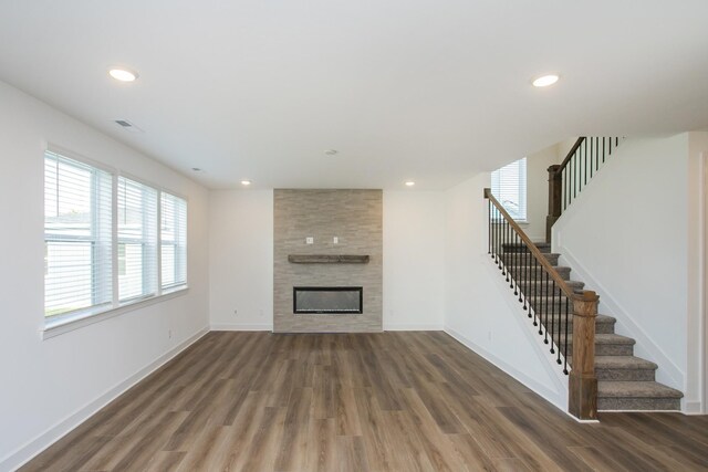 120 W Cassa Way, Mount Juliet, TN 37122 - unfurnished living room featuring wood finished floors, stairway, baseboards, and recessed lighting