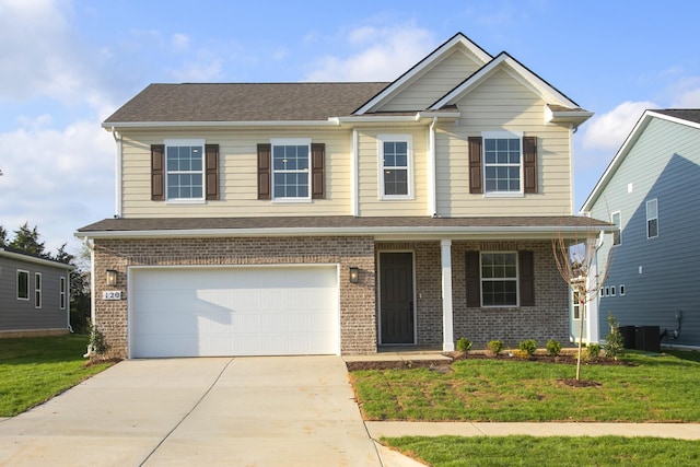 120 W Cassa Way, Mount Juliet, TN 37122 - view of front of home featuring an attached garage, driveway, a front yard, brick siding, and covered porch