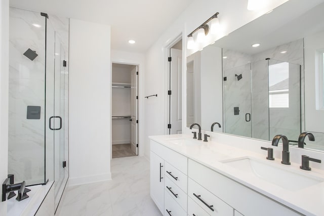122 W Cassa Way, Mount Juliet, TN 37122 - bathroom with a marble finish shower, a walk in closet, marble finish flooring, double vanity, and recessed lighting