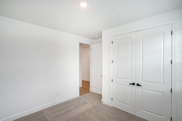 122 W Cassa Way, Mount Juliet, TN 37122 - unfurnished bedroom featuring baseboards, light carpet, and a closet