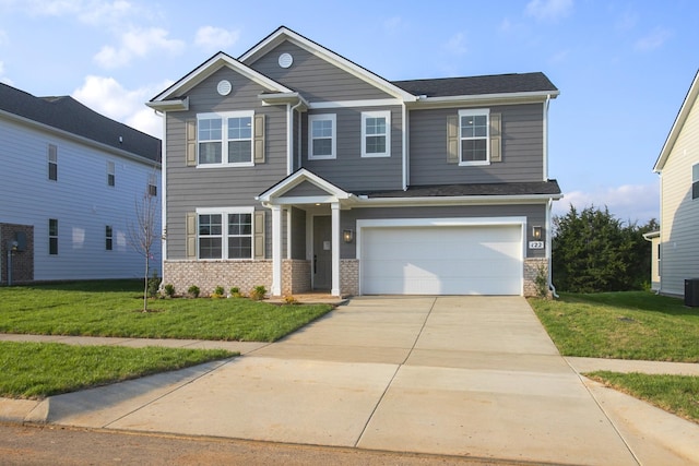 122 W Cassa Way, Mount Juliet, TN 37122 - view of front of home with a garage, concrete driveway, a front lawn, and brick siding