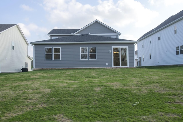 122 W Cassa Way, Mount Juliet, TN 37122 - rear view of property featuring a yard, a shingled roof, and central air condition unit