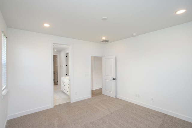 122 W Cassa Way, Mount Juliet, TN 37122 - unfurnished bedroom with light colored carpet, recessed lighting, baseboards, and connected bathroom