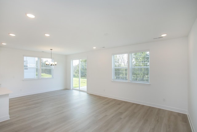 122 W Cassa Way, Mount Juliet, TN 37122 - spare room featuring a chandelier, light wood-style flooring, recessed lighting, and baseboards