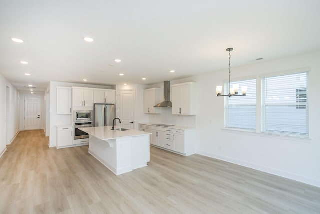 122 W Cassa Way, Mount Juliet, TN 37122 - kitchen featuring wall chimney exhaust hood, stainless steel appliances, a sink, a chandelier, and baseboards