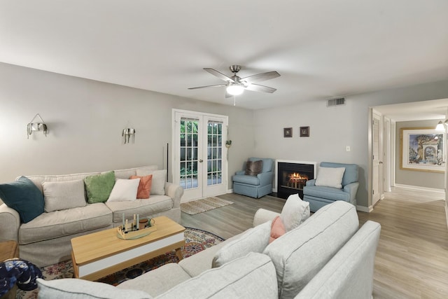 2433 Kennedy Ct Unit 2433, Franklin, TN 37064 - living area featuring french doors, light wood-type flooring, ceiling fan, and baseboards